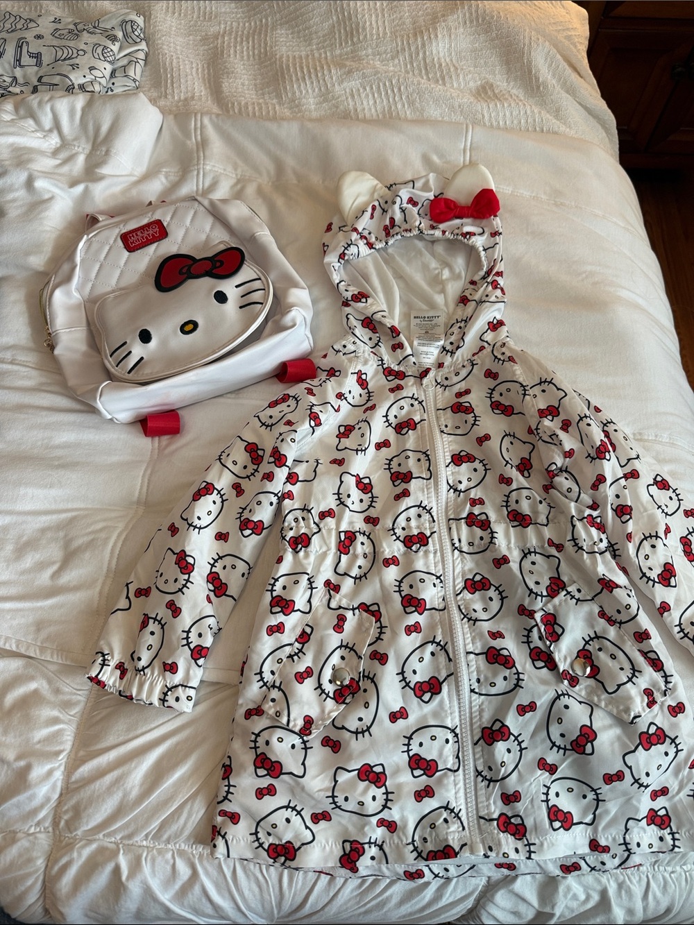 Hello Kitty Rain Coat and White Leather Backpack